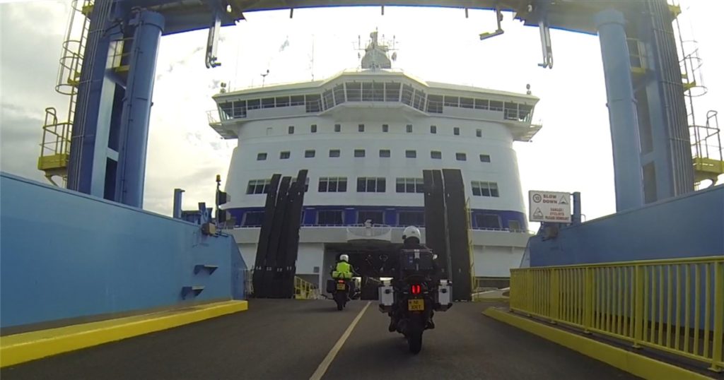 Motorcycle getting on ferry