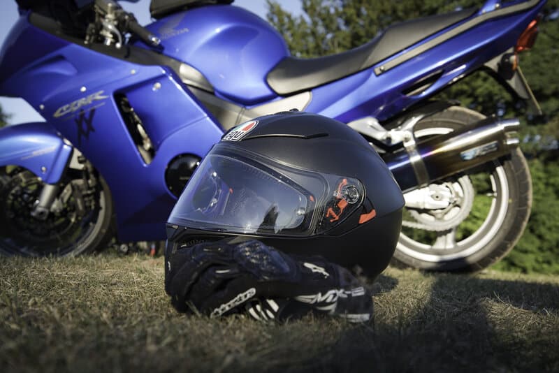 rsz motorcycle riders hub motorcycel and helment on the grass